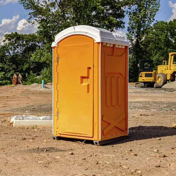 what is the cost difference between standard and deluxe portable restroom rentals in Bay Minette